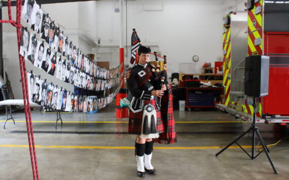 Lt. Ann Hoag of South King Fire is part of Puget Sound Firefighters Pipes and Drums and performed after a moment of silence at the 9/11 memorial tribute event this year. Photo by Keelin Everly-Lang / the Mirror