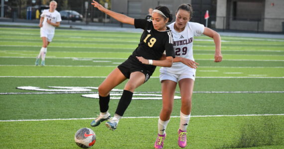 Senior Alexa Galmichi for Decatur fights for possession. Ben Ray / The Mirror