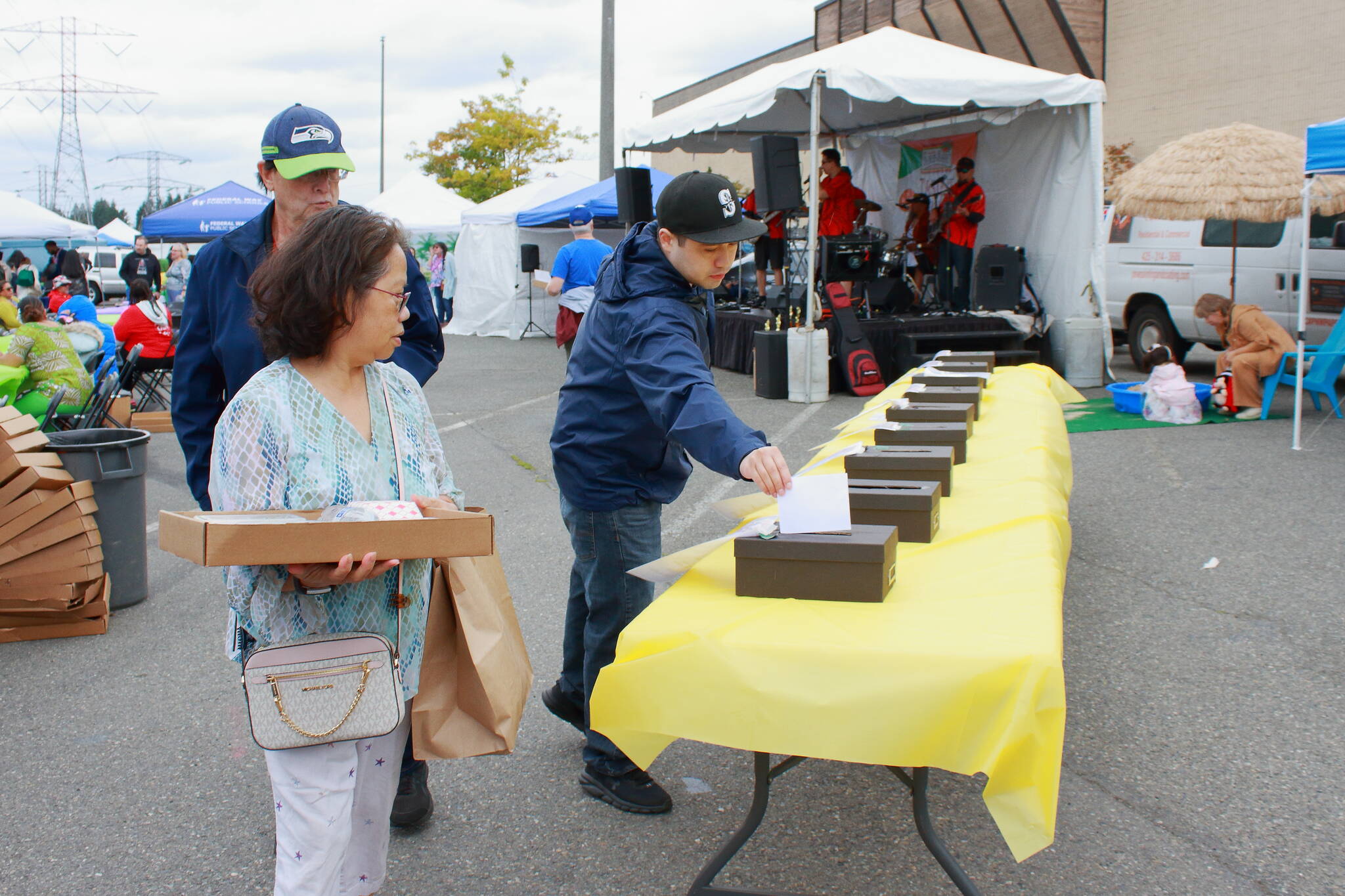 Guests voted for their favorite restaurant at The Taste of Federal Way in this photo from the 2023 event. The event concludes with awards given by judges as well as for People’s Choice, based on votes dropped in these boxes throughout the day. File photo