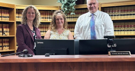 Pictured left to right: Stacie Scarpaci, Ashley Pfaff, and Judge David Larson. Courtesy photo