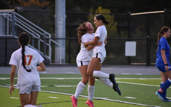 Jazmyne DuBose and Athena Amor Katsaros celebrate a goal against Federal Way. Ben Ray / The Mirror