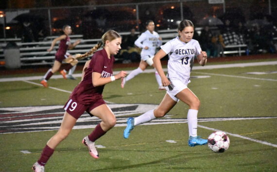 Maya Rainey chases down a Kentlake player in the first half at Kentlake High School. Ben Ray / The Mirror