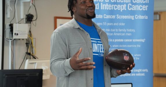 Seattle Seahawks linebacker Boye Mafe with the Oct. 6 game ball at St. Francis Hospital Medical Office Building, 34509 9th Ave. S. Photo by Joshua Solorzano/The Mirror