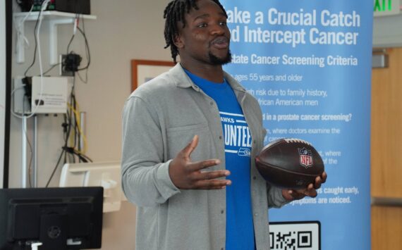 Seattle Seahawks linebacker Boye Mafe with the Oct. 6 game ball at St. Francis Hospital Medical Office Building, 34509 9th Ave. S. Photo by Joshua Solorzano/The Mirror