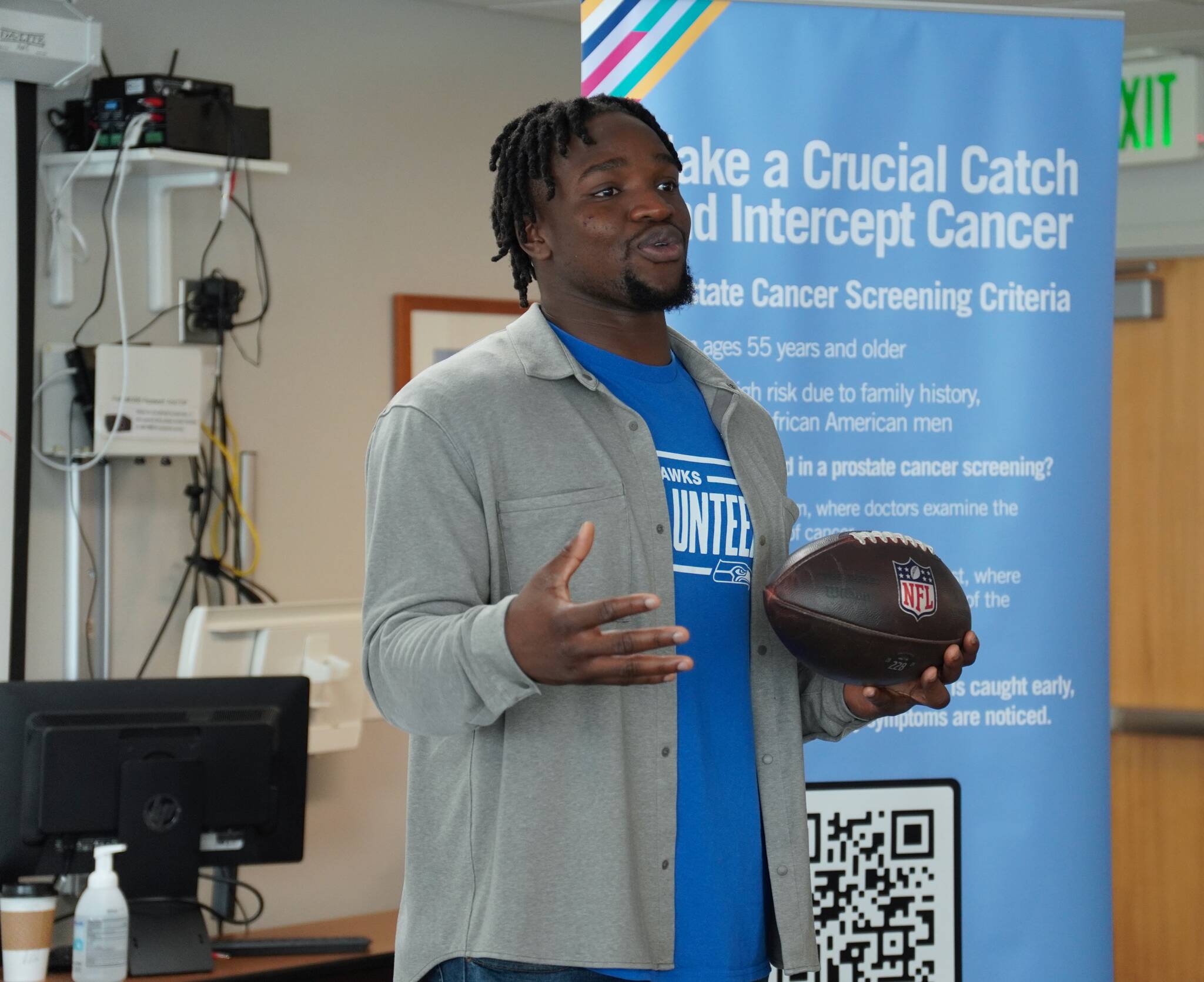 Seattle Seahawks linebacker Boye Mafe with the Oct. 6 game ball at St. Francis Hospital Medical Office Building, 34509 9th Ave. S. Photo by Joshua Solorzano/The Mirror