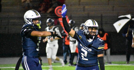 Decatur defenders Jasonni Prum (right) and Sefa Leapai celebrate a sack. Ben Ray / The Mirror