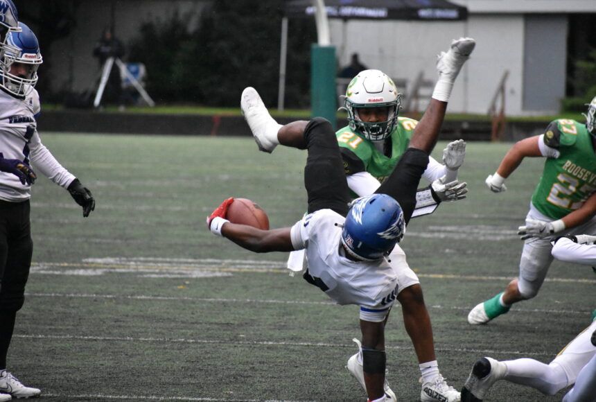 <p>Federal Way junior Zamarie Tellez gets tackled by Roosevelt in the opening round of the state tournament. Ben Ray / The Mirror</p>