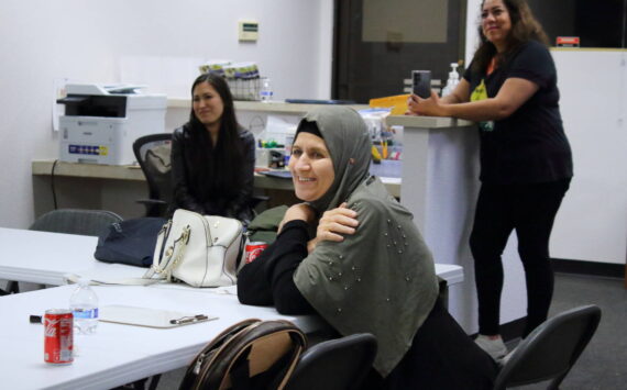 Nooriya Assi Sulaman is a graduate of the Mujer al Volante driving instruction class in Federal Way. Behind her are two of the Mujer al Volante staff. Photo by Keelin Everly-Lang / the Mirror.