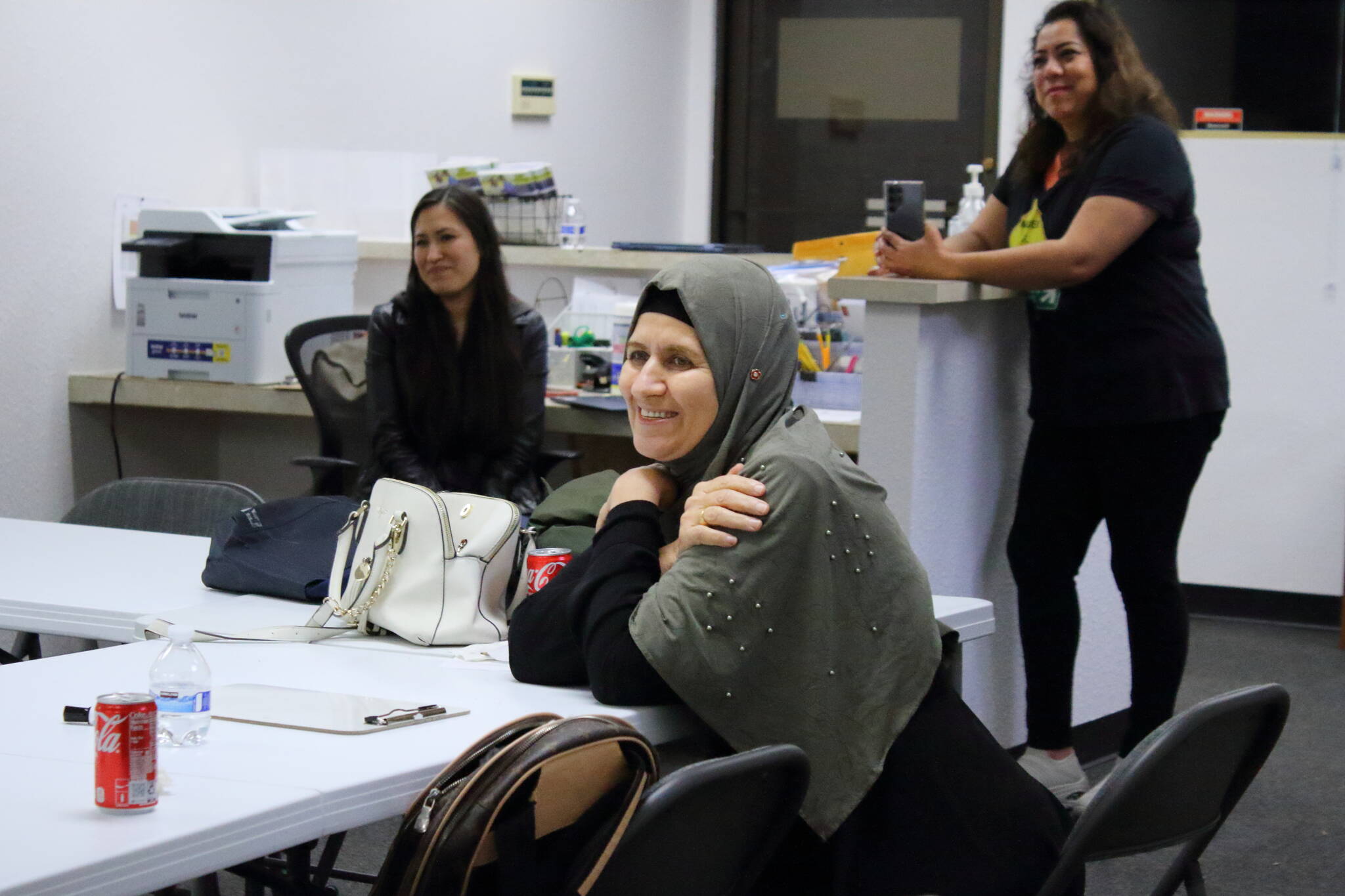 Nooriya Assi Sulaman is a graduate of the Mujer al Volante driving instruction class in Federal Way. Behind her are two of the Mujer al Volante staff. Photo by Keelin Everly-Lang / the Mirror.