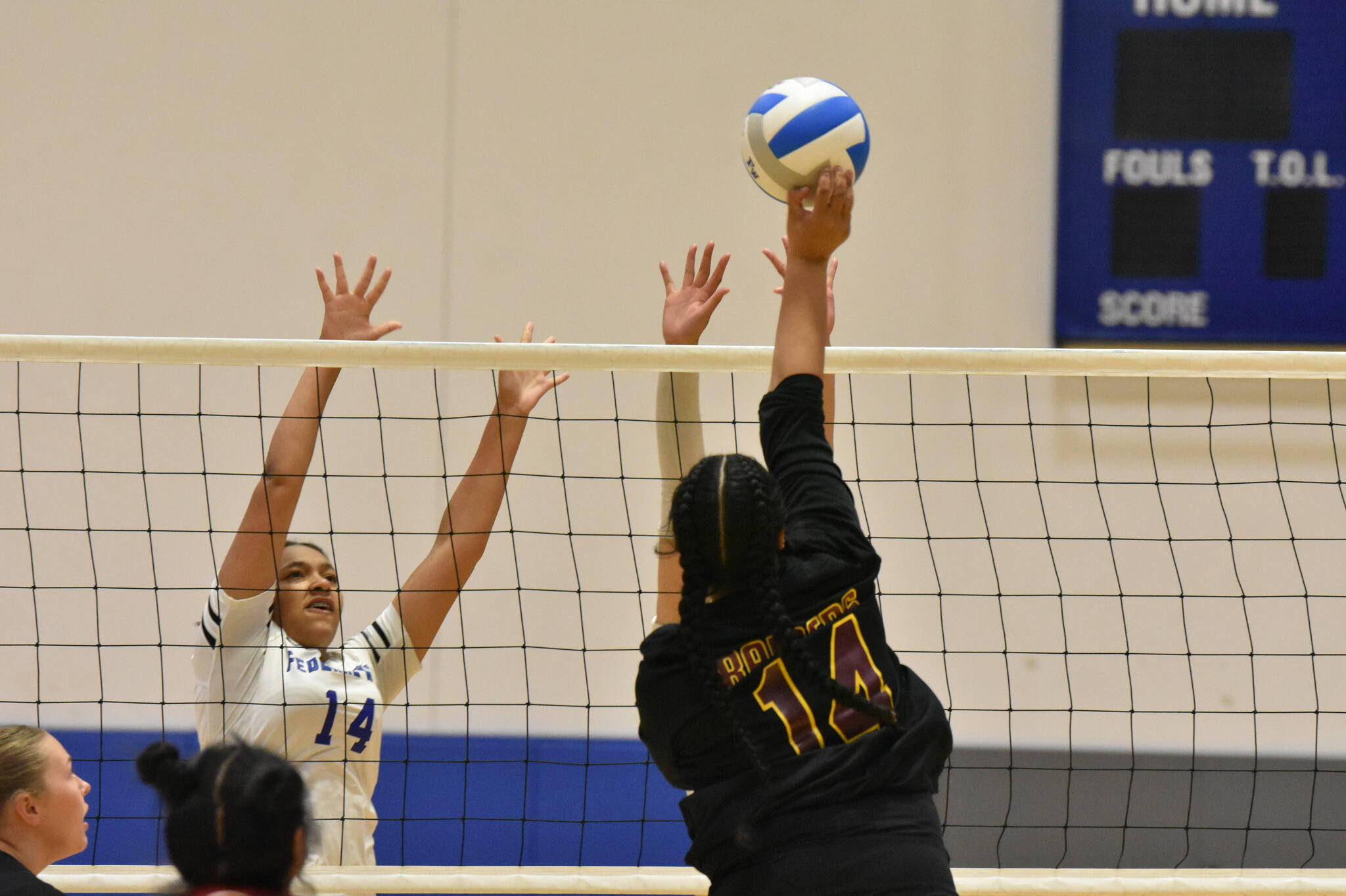 Thomas Jefferson senior Anelia Fatuesi tries to beat a pair of Eagle blockers. Ben Ray / The Mirror