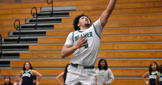 Titan senior Terrence Whiting goes up for a layup in the closing moments of the win against North Creek. Ben Ray / The Mirror