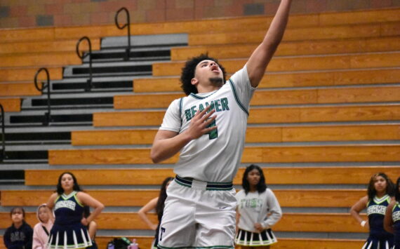 Titan senior Terrence Whiting goes up for a layup in the closing moments of the win against North Creek. Ben Ray / The Mirror