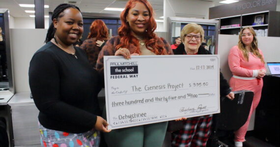 Learning Leaders Ka’Shayla Jewell and Rhonda Young present the check to Center Director and Case Manager for the Genesis Project Dehystinee Davis. Photo by Keelin Everly-Lang / the Mirror