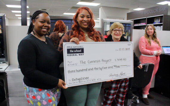 Learning Leaders Ka’Shayla Jewell and Rhonda Young present the check to Center Director and Case Manager for the Genesis Project Dehystinee Davis. Photo by Keelin Everly-Lang / the Mirror