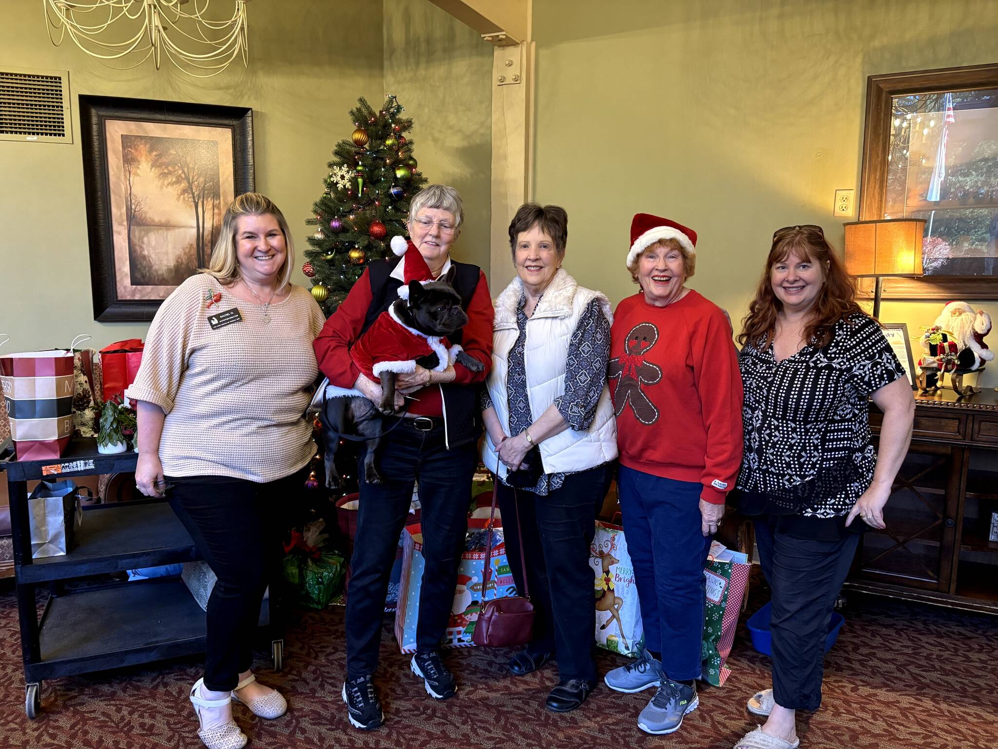 Rachel O’Reilly from Life Care Center, Maxine Ranta, Diane Goss, Penny Merriman and Carrie Asselin working together to brighten the holidays for everyone. Photo provided by Debbie Angel.