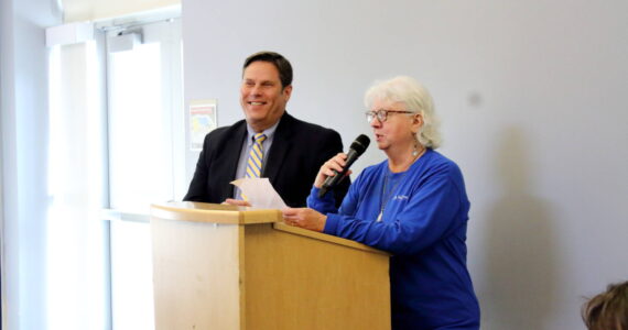 Federal Way Senior Commission member Lana Bostic introduces Federal Way Mayor Jim Ferrell as the guest speaker at their monthly Senior Commission Connections event on Dec. 18 at the Federal Way Community Center. Photo by Keelin Everly-Lang / the Mirror