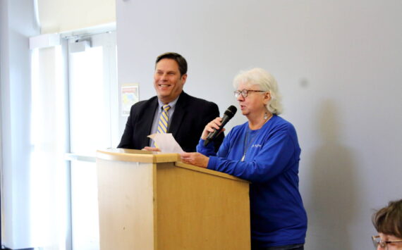 Federal Way Senior Commission member Lana Bostic introduces Federal Way Mayor Jim Ferrell as the guest speaker at their monthly Senior Commission Connections event on Dec. 18 at the Federal Way Community Center. Photo by Keelin Everly-Lang / the Mirror