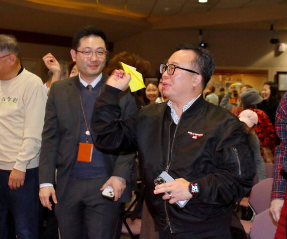 The future Hanwoori Garden was among topics at the quarterly gathering of the local Korean community Dec. 17 at Federal Way City Hall. The evening ended with colorful paper airplanes launched at the front of the room, each with a message written on it with people’s hopes for the Hanwoori Garden. Photo by Keelin Everly-Lang / the Mirror