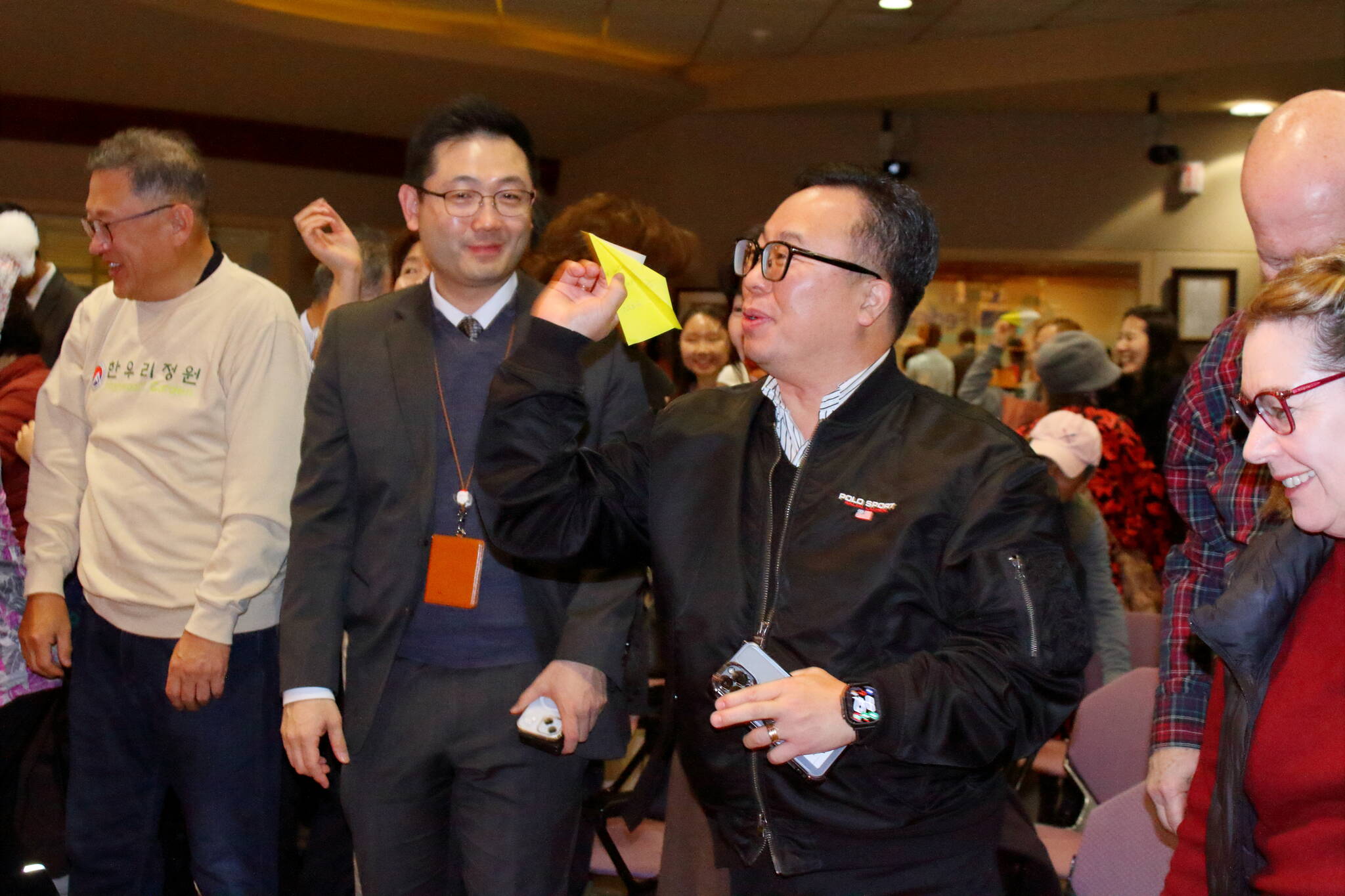 The future Hanwoori Garden was among topics at the quarterly gathering of the local Korean community Dec. 17 at Federal Way City Hall. The evening ended with colorful paper airplanes launched at the front of the room, each with a message written on it with people’s hopes for the Hanwoori Garden. Photo by Keelin Everly-Lang / the Mirror