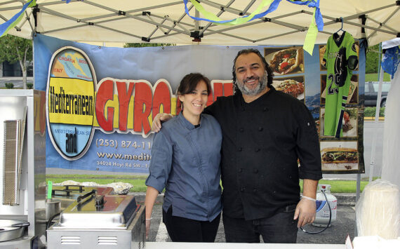 Mediterranean Gyro Grill owner Jay Barbour, right, and his restaurant manager pictured at the Taste of Federal Way in 2019. File photo