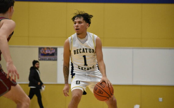 Jorge Martinez Lopez dribbles the basketball for Decatur against Kentlake. Ben Ray / The Mirror