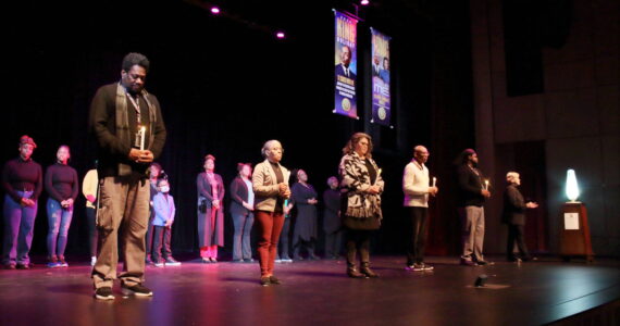 Federal Way community members are honored by carrying a torch to light the community flame during the MLK Day Celebration held Jan. 15, 2024, at the Federal Way Performing Arts and Event Center. Photo by Keelin Everly-Lang / The Mirror.