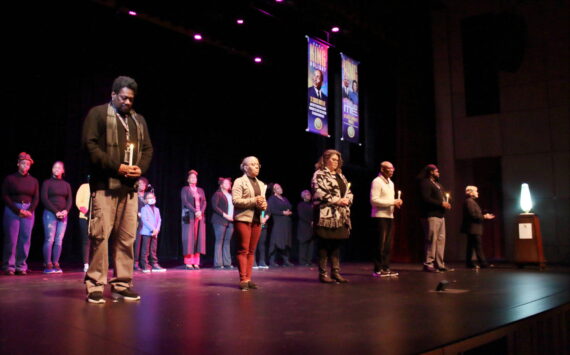 Federal Way community members are honored by carrying a torch to light the community flame during the MLK Day Celebration held Jan. 15, 2024, at the Federal Way Performing Arts and Event Center. Photo by Keelin Everly-Lang / The Mirror.