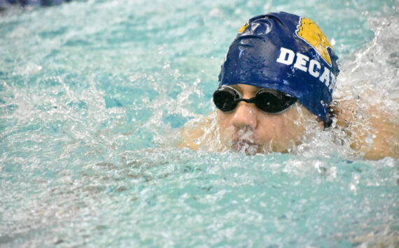 Decatur swimmer eyes down the finish of his race. Photos by Ben Ray / The Mirror